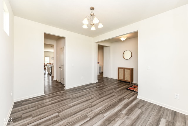 7101 Oak Trace Ln, Brownsburg, IN 46112 - unfurnished room with a chandelier and wood finished floors