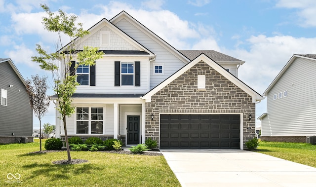 7101 Oak Trace Ln, Brownsburg, IN 46112 - view of front of property with stone siding, concrete driveway, a front yard, and a garage