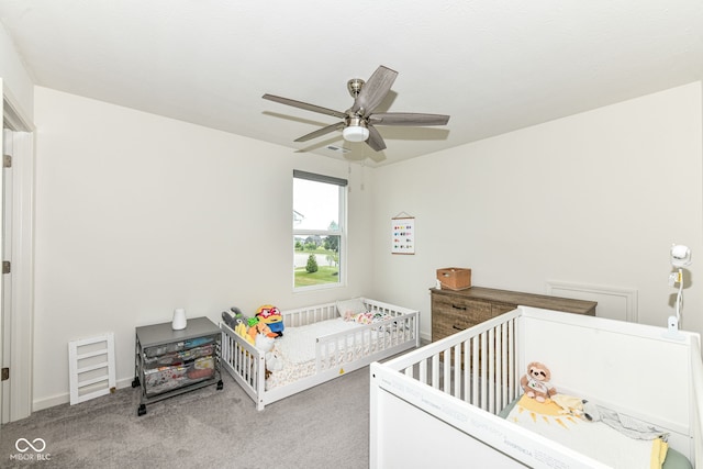 7101 Oak Trace Ln, Brownsburg, IN 46112 - carpeted bedroom with a nursery area and a ceiling fan
