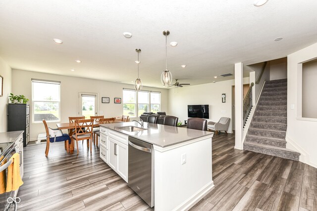 7101 Oak Trace Ln, Brownsburg, IN 46112 - kitchen with appliances with stainless steel finishes, wood finished floors, white cabinetry, recessed lighting, and plenty of natural light