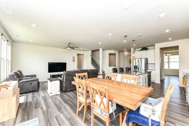 7101 Oak Trace Ln, Brownsburg, IN 46112 - dining space with wood finished floors, stairs, a ceiling fan, and recessed lighting