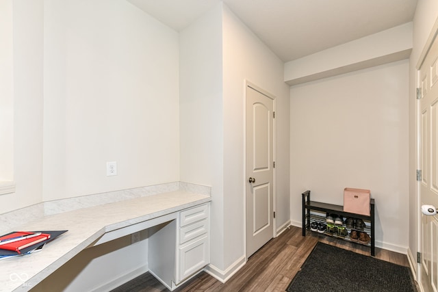 7101 Oak Trace Ln, Brownsburg, IN 46112 - office featuring built in desk and dark wood finished floors