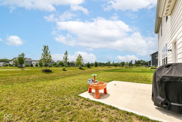 7101 Oak Trace Ln, Brownsburg, IN 46112 - view of green lawn with a patio area
