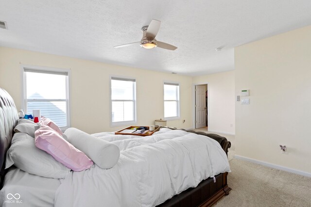 2454 N Talbott St, Indianapolis, IN 46205 - bedroom featuring a ceiling fan, a textured ceiling, and light carpet