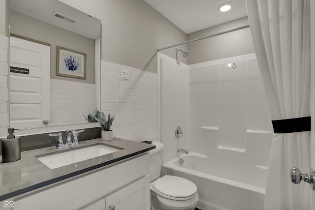 918 Shadow Dr, Danville, IN 46122 - full bathroom with vanity, shower / tub combo with curtain, and tile walls
