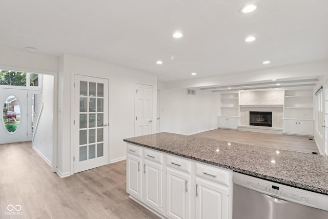 11845 Discovery Cir, Indianapolis, IN 46236 - kitchen with stainless steel dishwasher, light wood-style floors, dark stone counters, white cabinetry, and recessed lighting