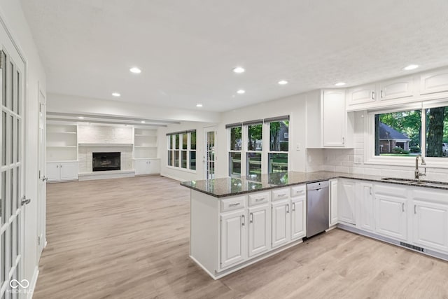 11845 Discovery Cir, Indianapolis, IN 46236 - kitchen featuring stainless steel dishwasher, light wood finished floors, dark stone counters, white cabinets, and recessed lighting