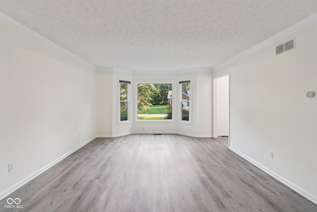 11845 Discovery Cir, Indianapolis, IN 46236 - empty room with wood finished floors, a textured ceiling, and crown molding