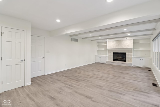 11845 Discovery Cir, Indianapolis, IN 46236 - unfurnished living room featuring beamed ceiling, light wood-type flooring, recessed lighting, and a brick fireplace