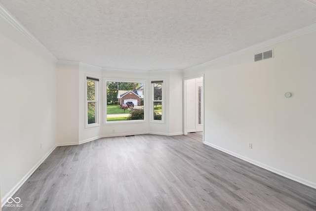 11845 Discovery Cir, Indianapolis, IN 46236 - empty room with wood finished floors, a textured ceiling, and ornamental molding