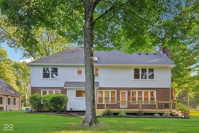 11845 Discovery Cir, Indianapolis, IN 46236 - rear view of house with a chimney, a yard, and brick siding