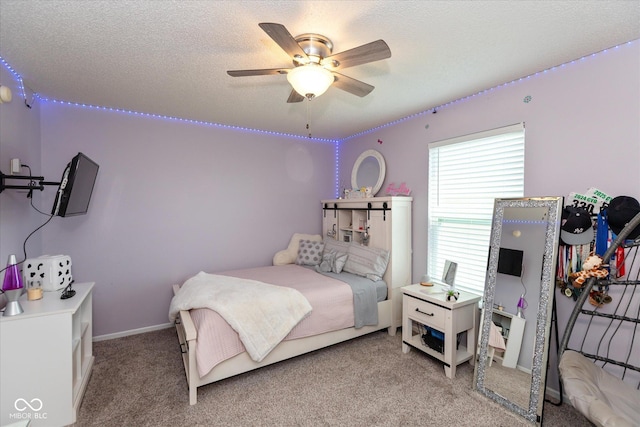 7950 Crackling Ln, Indianapolis, IN 46259 - bedroom featuring light carpet, a textured ceiling, and a ceiling fan