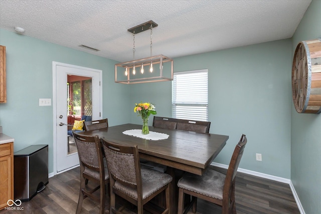 7950 Crackling Ln, Indianapolis, IN 46259 - dining room with dark wood-type flooring and a textured ceiling