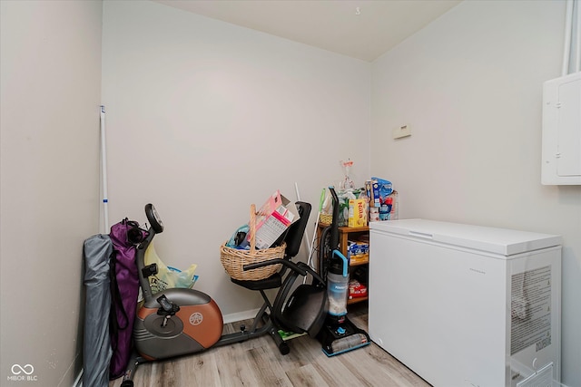 2466 Sickle Rd, Indianapolis, IN 46219 - laundry area featuring light wood-style floors and baseboards