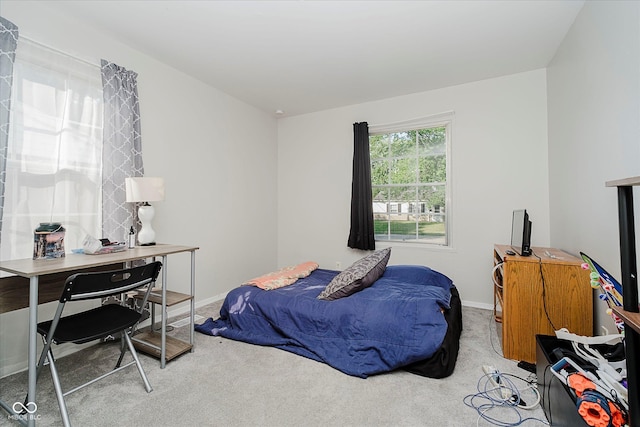 2466 Sickle Rd, Indianapolis, IN 46219 - carpeted bedroom featuring a desk and baseboards