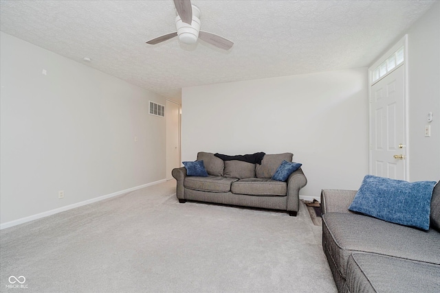 2466 Sickle Rd, Indianapolis, IN 46219 - living area featuring a textured ceiling, a ceiling fan, and light carpet
