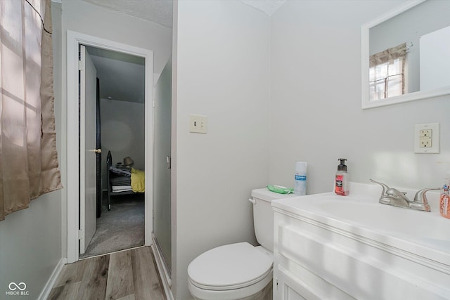 2466 Sickle Rd, Indianapolis, IN 46219 - bathroom featuring wood finished floors and vanity