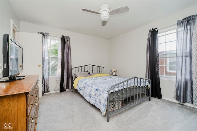 2466 Sickle Rd, Indianapolis, IN 46219 - bedroom featuring light carpet and a ceiling fan