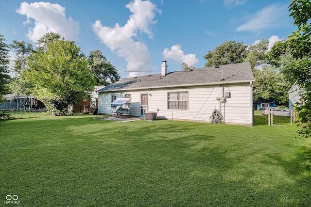 2466 Sickle Rd, Indianapolis, IN 46219 - back of property with a patio area and a chimney