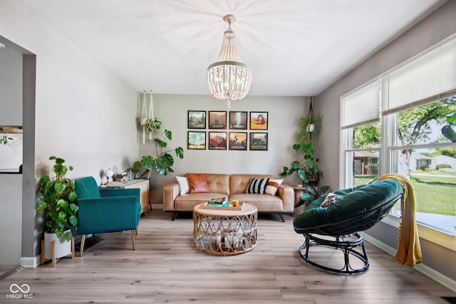 1743 Chandler Ln, Columbus, IN 47203 - living room featuring wood finished floors and a chandelier