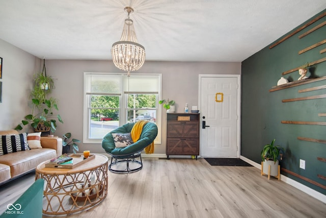 1743 Chandler Ln, Columbus, IN 47203 - foyer entrance with light wood-style flooring and a chandelier