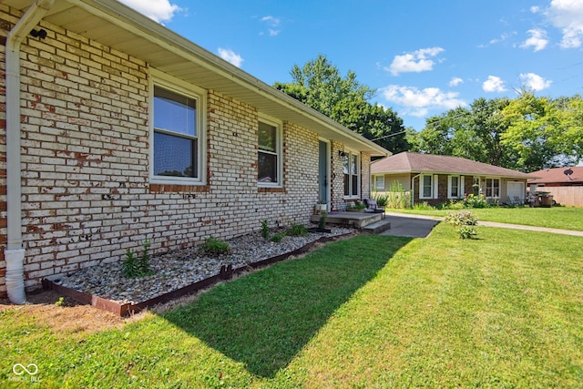 1743 Chandler Ln, Columbus, IN 47203 - view of front of property featuring brick siding and a front lawn