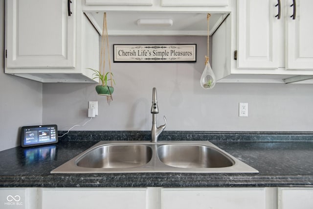 1743 Chandler Ln, Columbus, IN 47203 - kitchen view of white cabinetry and dark countertops