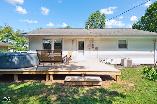 1743 Chandler Ln, Columbus, IN 47203 - rear view of house with a hot tub, a wooden deck, and roof with shingles