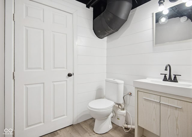 1743 Chandler Ln, Columbus, IN 47203 - half bathroom with vanity and wood finished floors