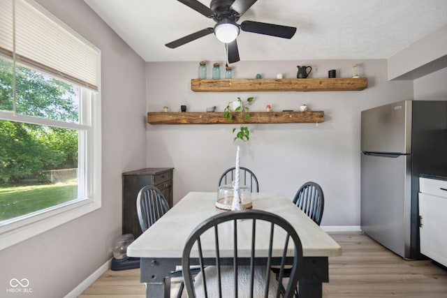 1743 Chandler Ln, Columbus, IN 47203 - dining area with light wood-style flooring and a ceiling fan