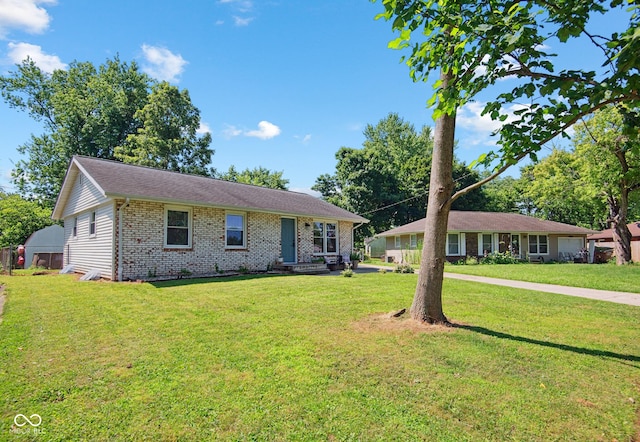 1743 Chandler Ln, Columbus, IN 47203 - single story home with brick siding and a front yard