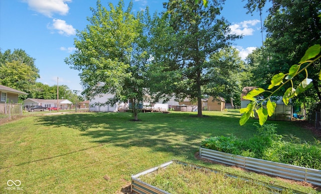 1743 Chandler Ln, Columbus, IN 47203 - fenced yard with a vegetable garden