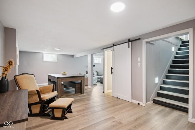 1743 Chandler Ln, Columbus, IN 47203 - sitting room with stairway, light wood-type flooring, and a barn door