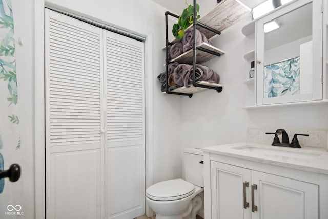 1743 Chandler Ln, Columbus, IN 47203 - bathroom featuring vanity, a closet, and a shower with shower curtain
