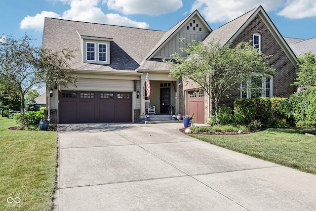 1387 Mayfield Ct, Westfield, IN 46074 - view of front of home with brick siding, board and batten siding, driveway, and a front yard