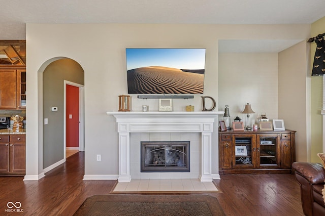 1387 Mayfield Ct, Westfield, IN 46074 - living area with wood finished floors, arched walkways, and a fireplace