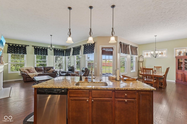 1387 Mayfield Ct, Westfield, IN 46074 - kitchen featuring stainless steel dishwasher, a chandelier, open floor plan, dark wood-type flooring, and a textured ceiling