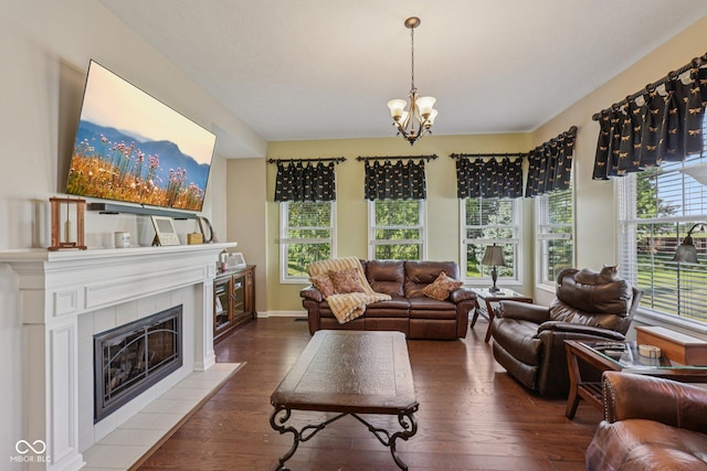 1387 Mayfield Ct, Westfield, IN 46074 - living room featuring wood finished floors, a chandelier, and a fireplace
