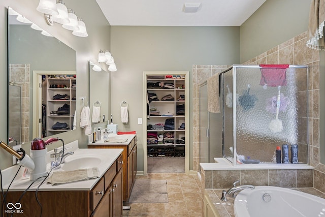 1387 Mayfield Ct, Westfield, IN 46074 - bathroom with a spacious closet, vanity, a stall shower, and a garden tub