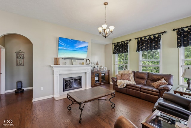 1387 Mayfield Ct, Westfield, IN 46074 - living area with arched walkways, wood finished floors, a chandelier, and a fireplace