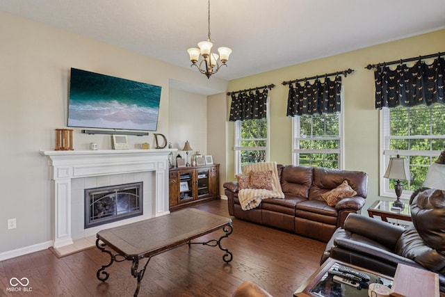1387 Mayfield Ct, Westfield, IN 46074 - living room with wood finished floors, plenty of natural light, a chandelier, and a tiled fireplace