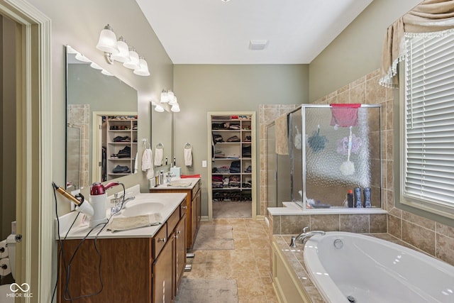 1387 Mayfield Ct, Westfield, IN 46074 - full bath with a spacious closet, vanity, a shower stall, a garden tub, and tile patterned flooring