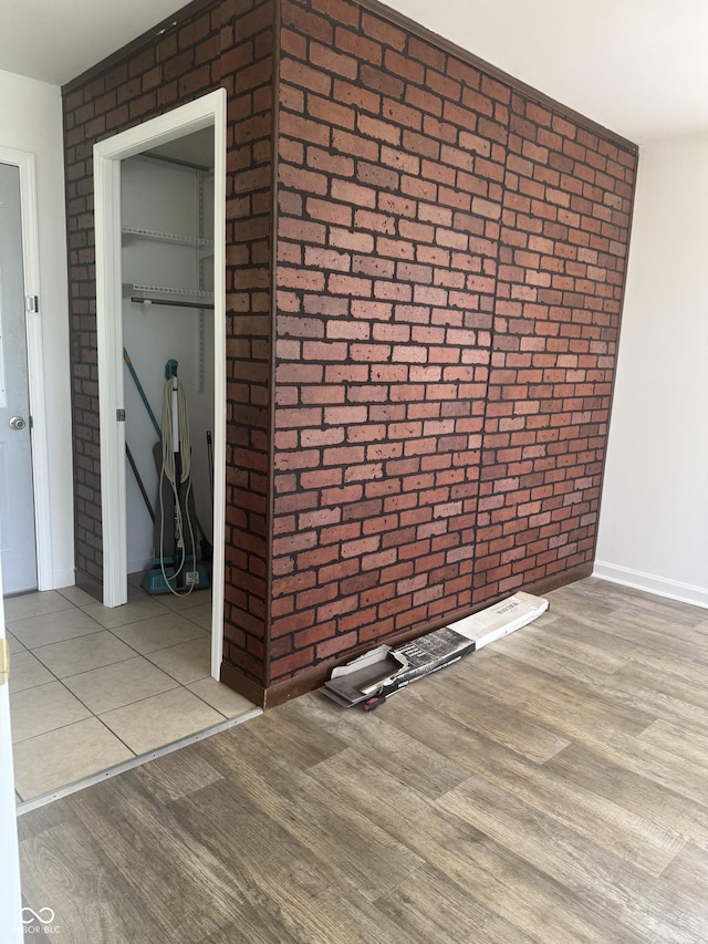 1831 N Main St, Franklin, IN 46131 - unfurnished room featuring brick wall and wood finished floors