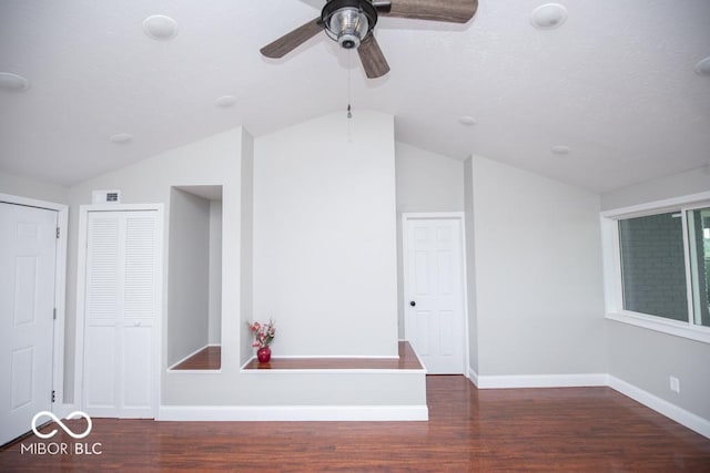 7950 N 475 E, Columbus, IN 47203 - spare room with vaulted ceiling, wood finished floors, and a ceiling fan