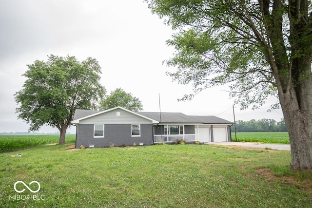 7950 N 475 E, Columbus, IN 47203 - ranch-style home with a garage, a front yard, driveway, and brick siding