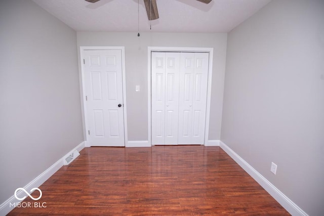 7950 N 475 E, Columbus, IN 47203 - unfurnished bedroom with wood finished floors, a closet, and ceiling fan