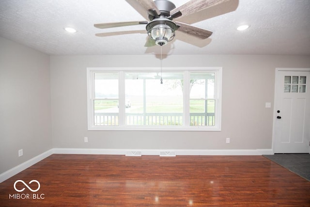 7950 N 475 E, Columbus, IN 47203 - unfurnished room featuring dark wood-style flooring, a textured ceiling, recessed lighting, and ceiling fan