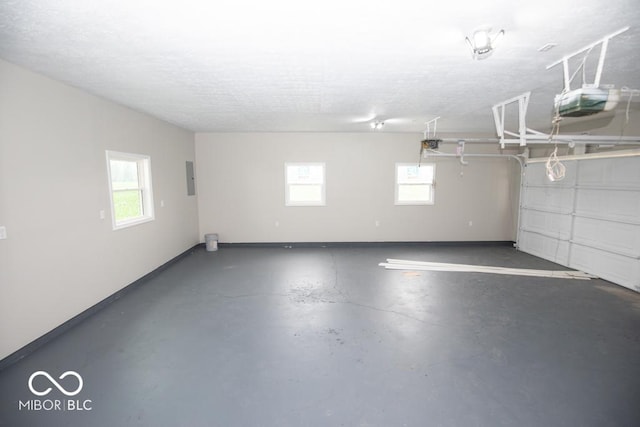 7950 N 475 E, Columbus, IN 47203 - garage featuring a garage door opener and electric panel