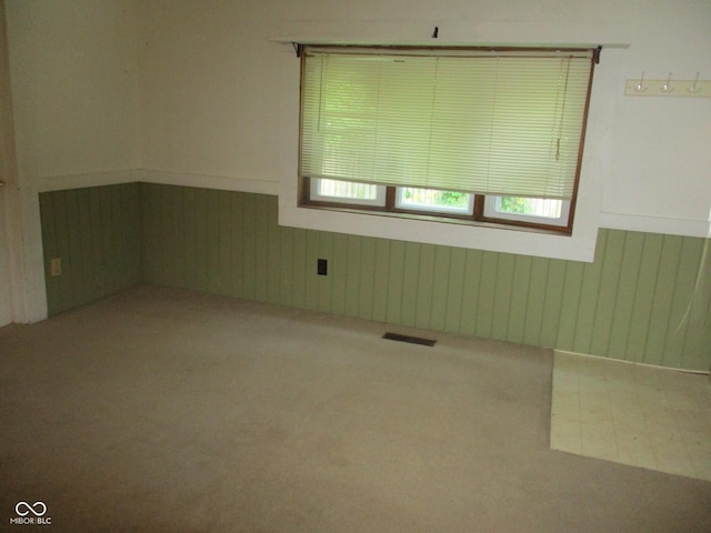 302 Lincoln St, Crawfordsville, IN 47933 - carpeted spare room with wainscoting