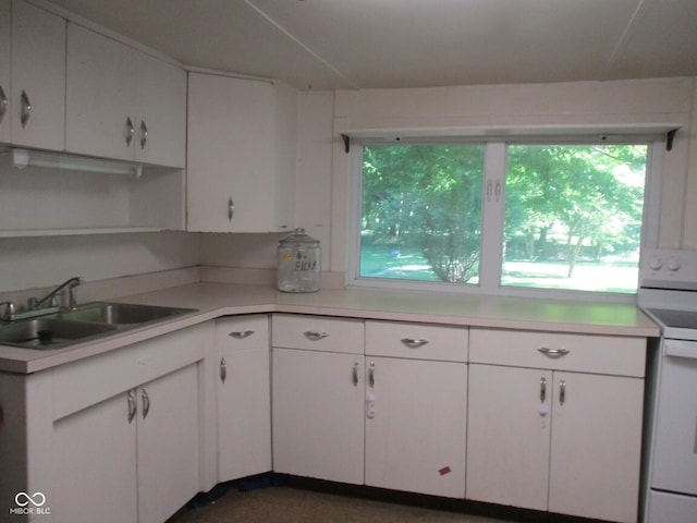 302 Lincoln St, Crawfordsville, IN 47933 - kitchen with electric range, plenty of natural light, and light countertops